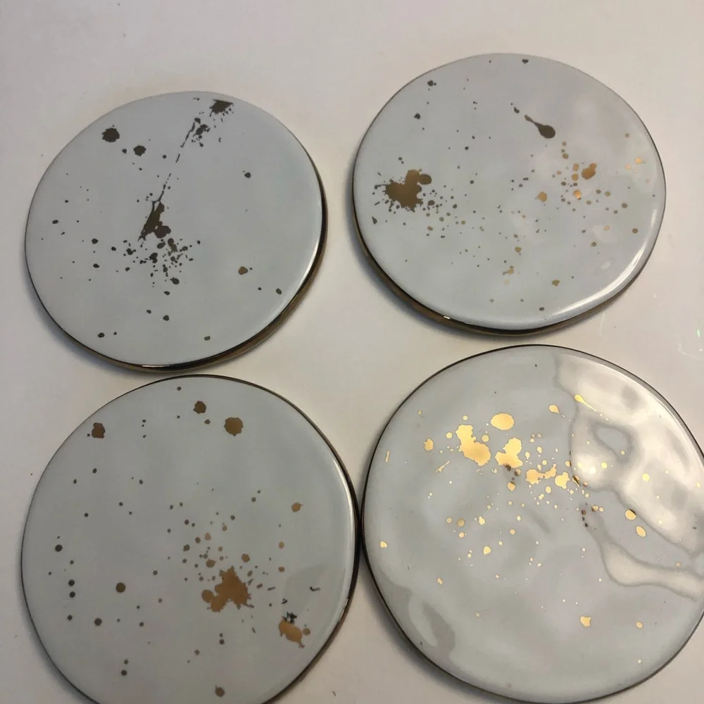 Ceramic coasters with gold trim and gold flecks